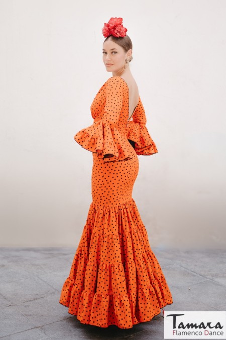 Aires de Feria Flamenco Dresses 2025 model Sonia flamenco dress orange with black polka dots 